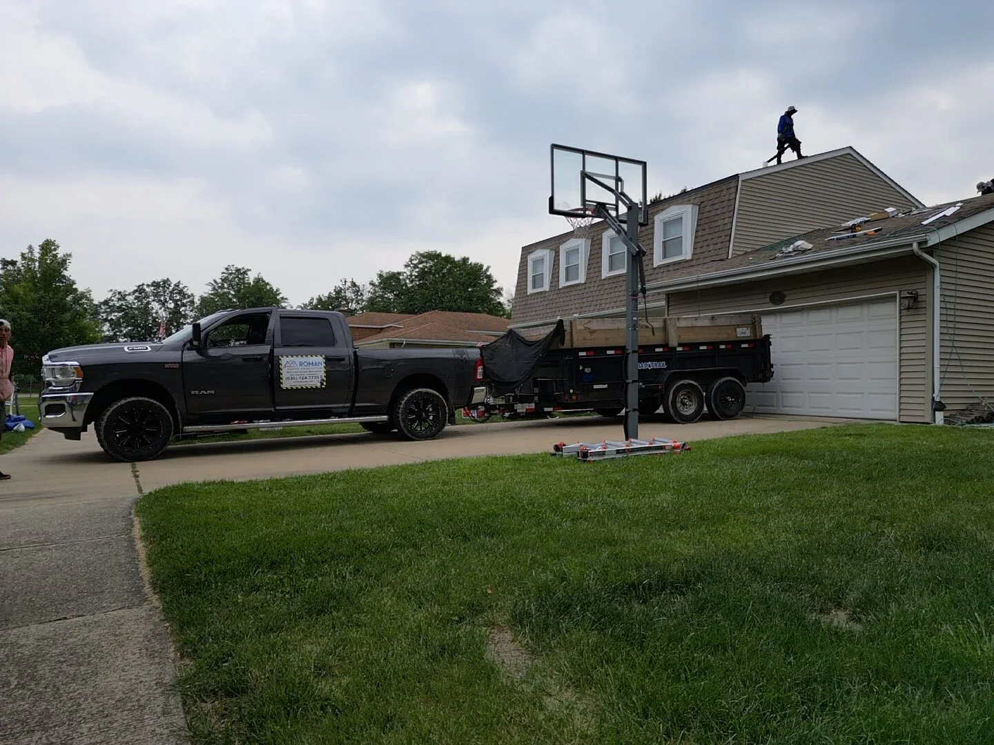 Roofing contractors at work