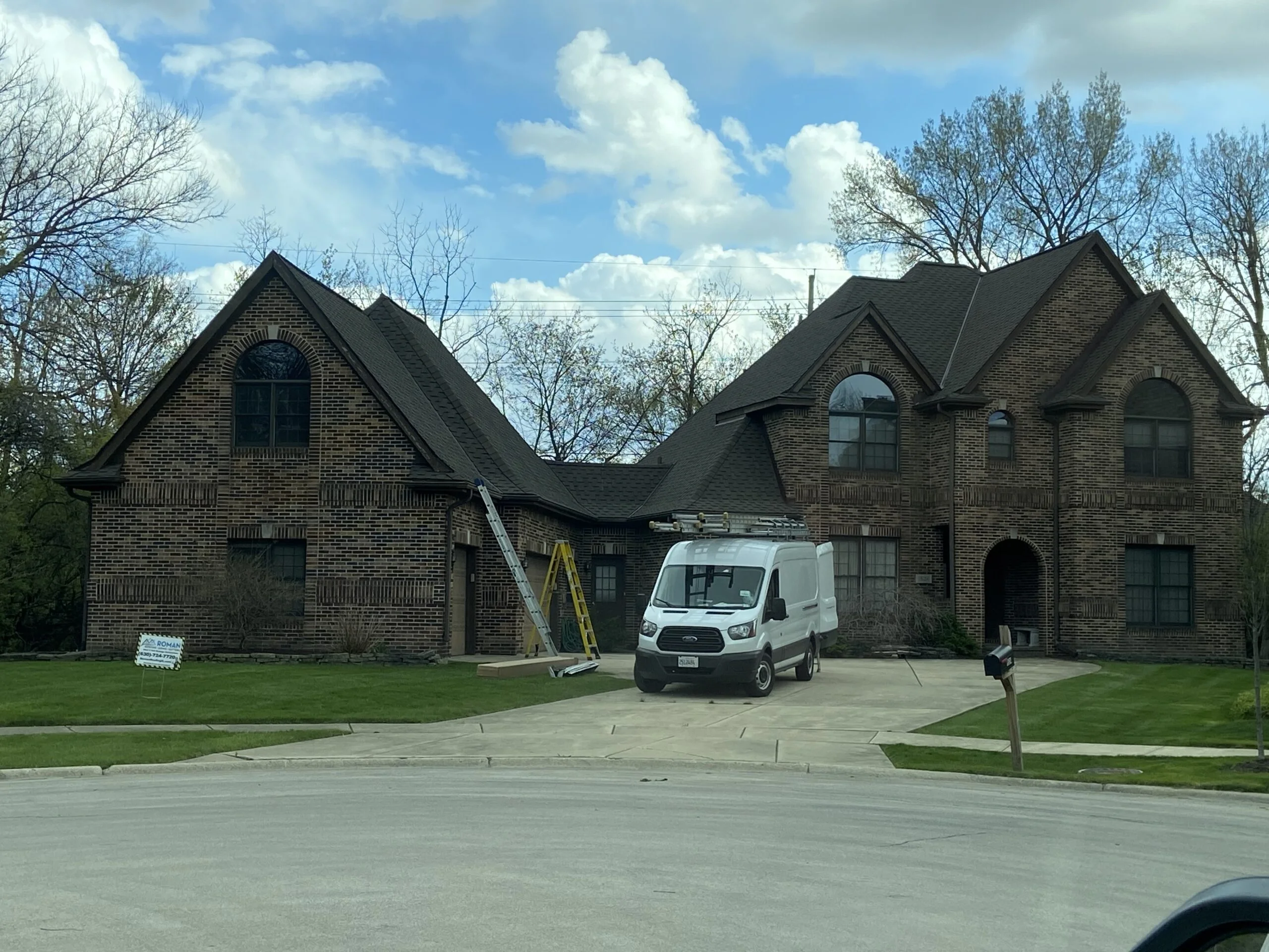 Roofing contractors at work